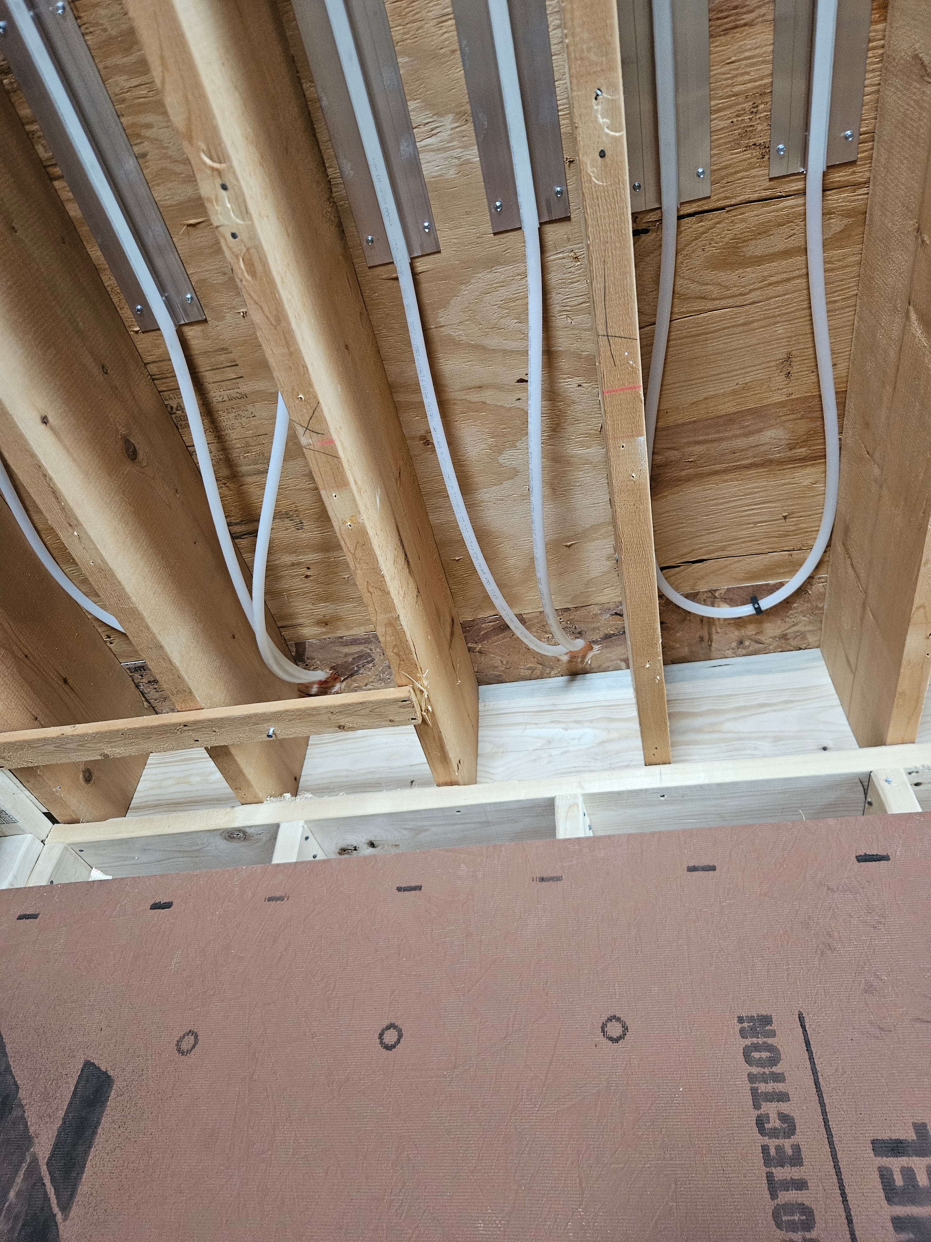 Running radiant lines in the ceiling at a renovation